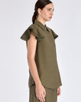 Side profile of the Olive Clark Blouse, highlighting the delicate ruffle detail on the short sleeve.