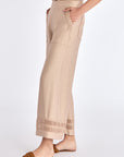 Side silhouette of the Nude Clark Ease Pant, showcasing the fluid, relaxed fit.