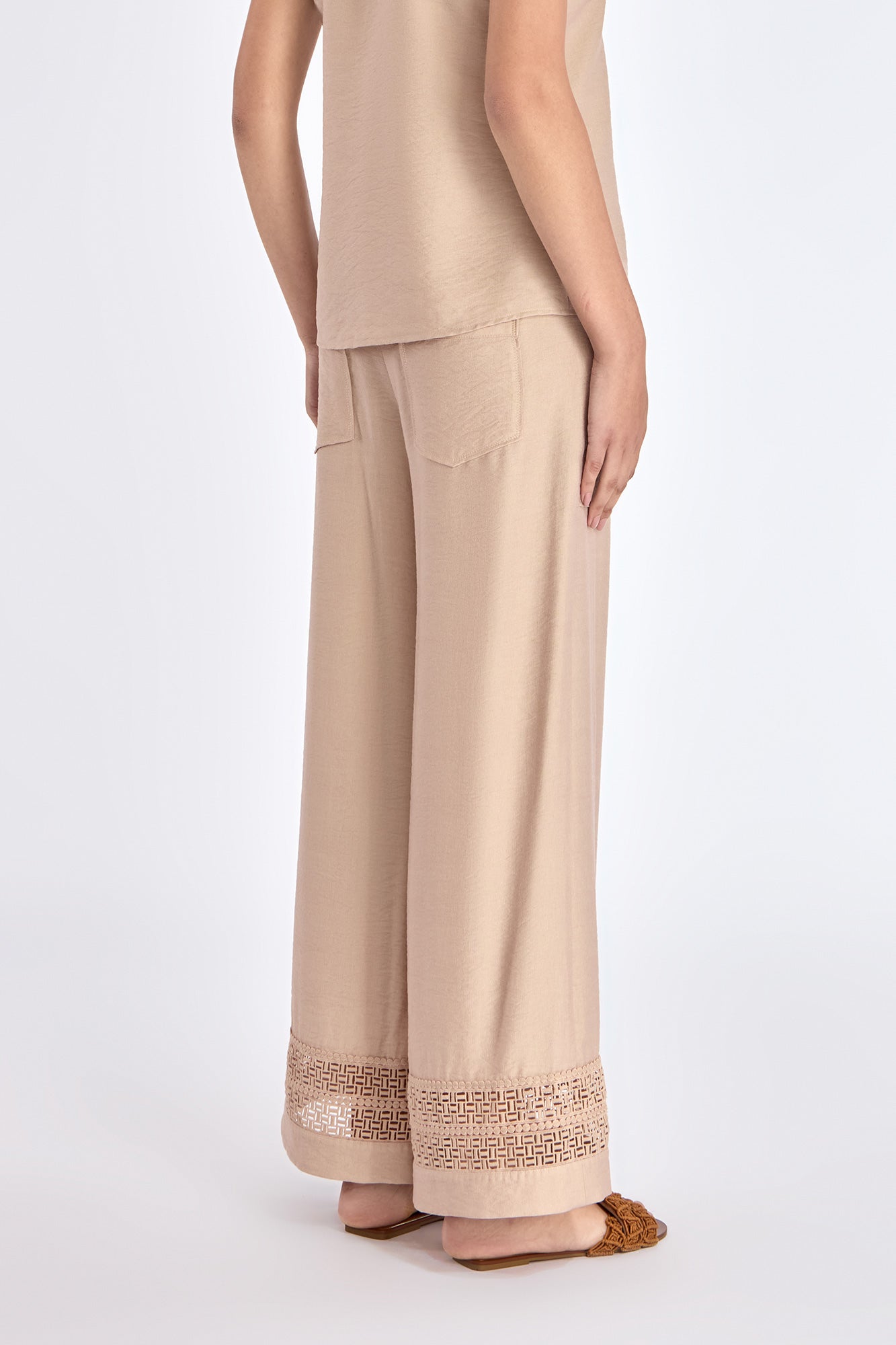 Elegant back view of the Clark Ease Pant in a nude hue.