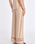 Elegant back view of the Clark Ease Pant in a nude hue.