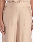 Close-up of the architectural diagonal pocket on the Nude Clark Ease Pant.