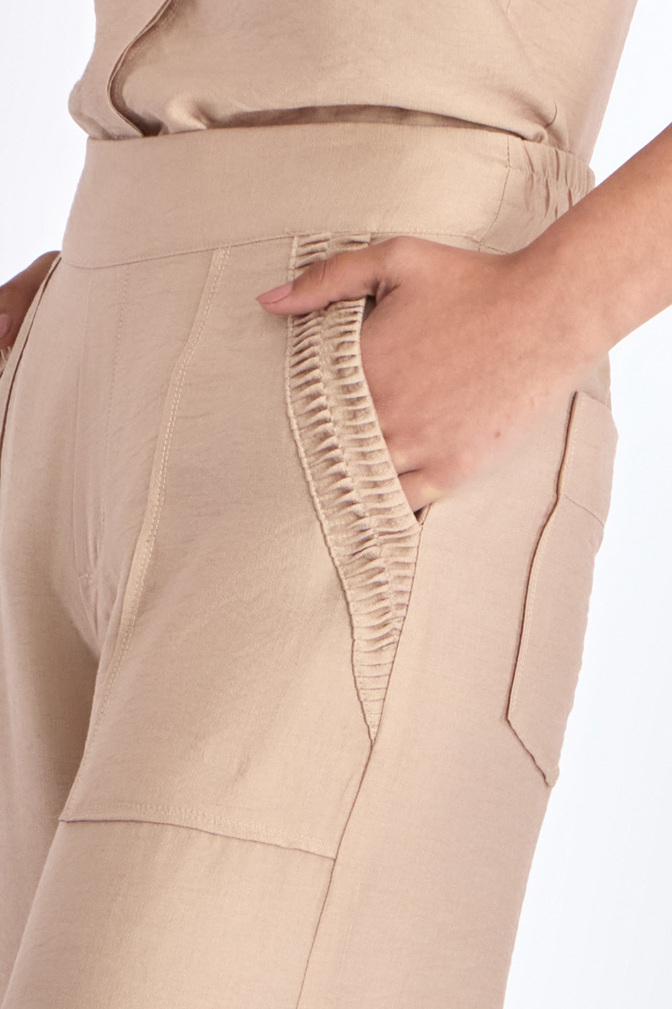 Close-up of the architectural diagonal pocket on the Nude Clark Ease Pant.