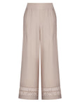 Model wearing the nude Clark Ease Pant, a soft knit trouser with an elastic waist.