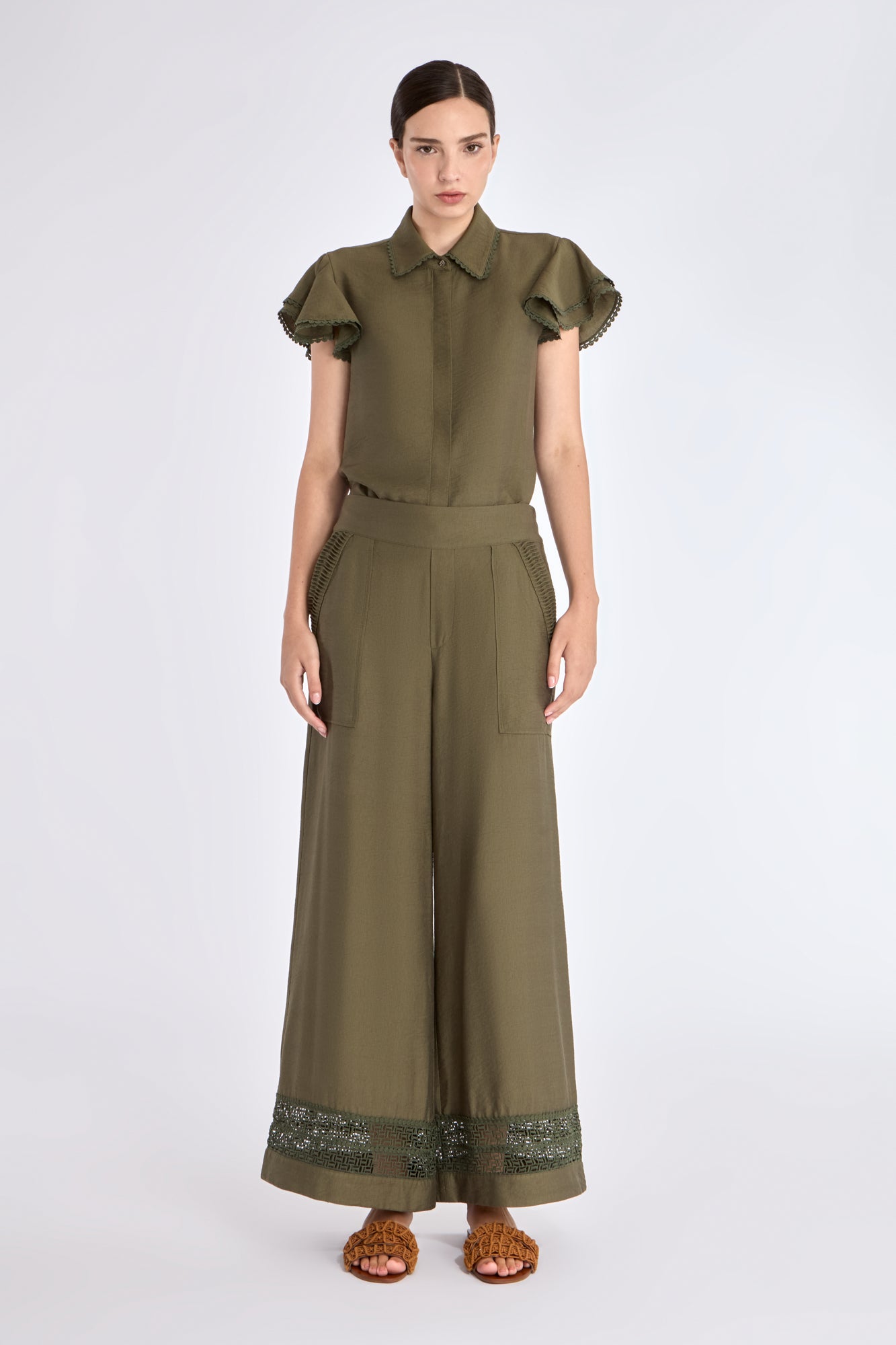 Front view of the Clark Ease Pant in olive, showcasing its soft knit fabric and relaxed fit.