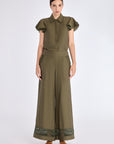 Front view of the Clark Ease Pant in olive, showcasing its soft knit fabric and relaxed fit.