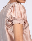 Davina silk top in blush with crochet ribbon accents and adjustable hem