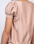 Davina silk top in blush with crochet ribbon accents and adjustable hem