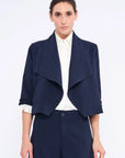 Front view of the Daysi Jacket in Navy, showcasing its elegant draped lapel and open-front design.
