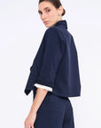 Side profile of the Navy Daysi Jacket, highlighting the fluid drape and three-quarter sleeves.