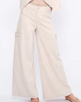 Front view of the Daysi Trouser in Ecru, showcasing its fluid wide-leg silhouette.