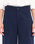 Front view of the Daysi Trouser in Ecru, showcasing its fluid wide-leg silhouette.
