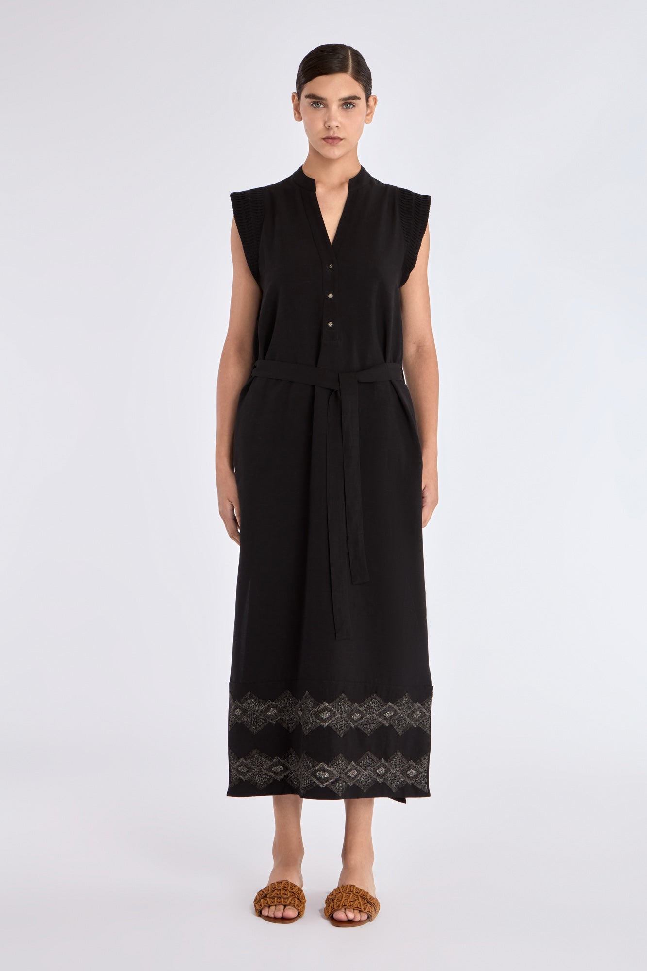 Front view of the Denver Dress in black, showcasing its Nehru collar and artisan-embroidered hem.