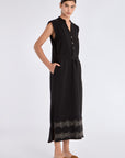 Side profile of the black Denver Dress, highlighting the fluid drape of the linen blend fabric.