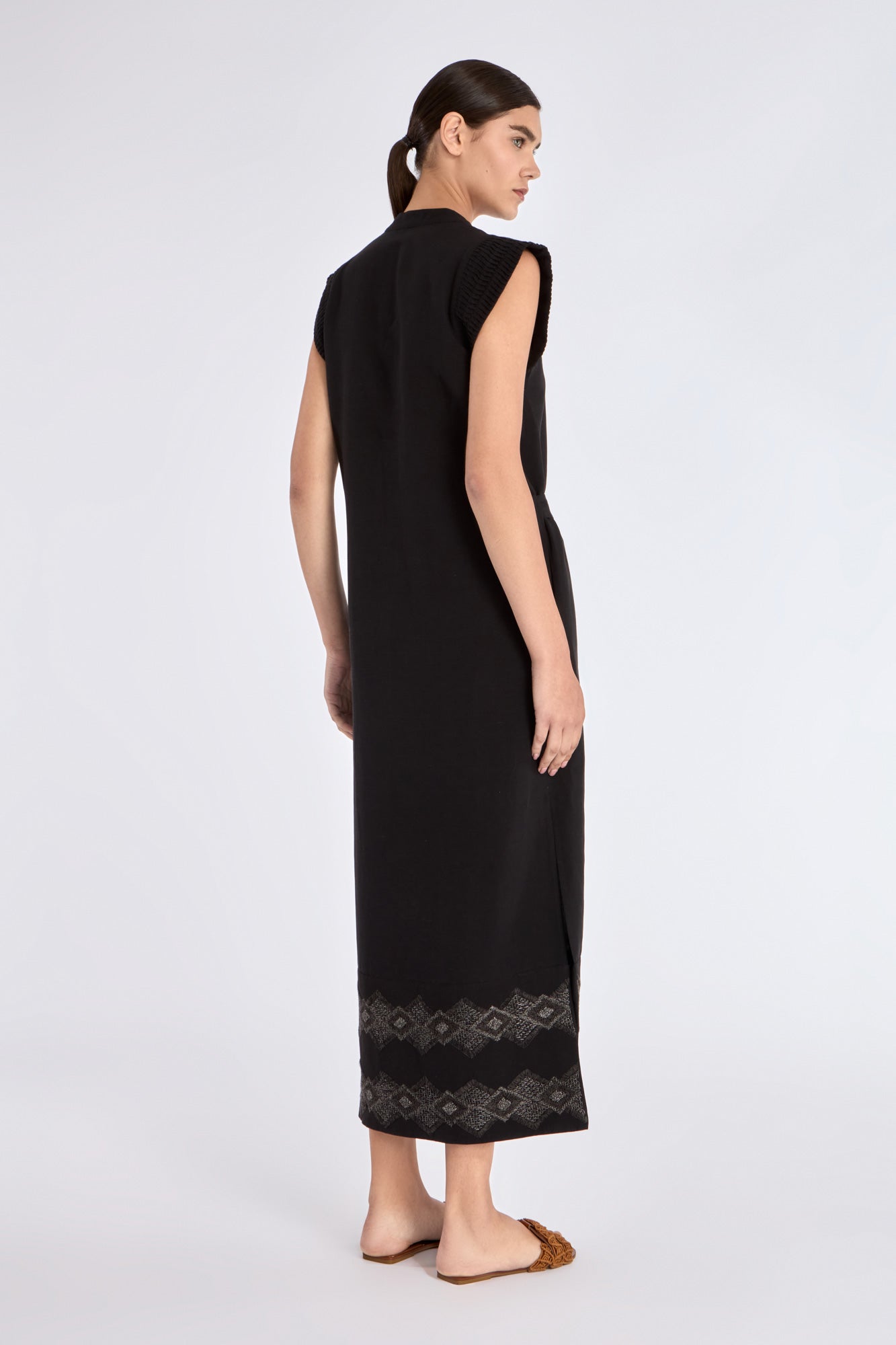 Elegant back view of the Denver Dress, showing the clean lines of its midi silhouette.