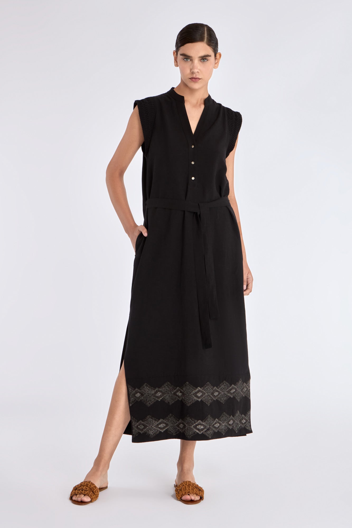 Front view of the Denver Dress in black, showcasing its Nehru collar and artisan-embroidered hem.