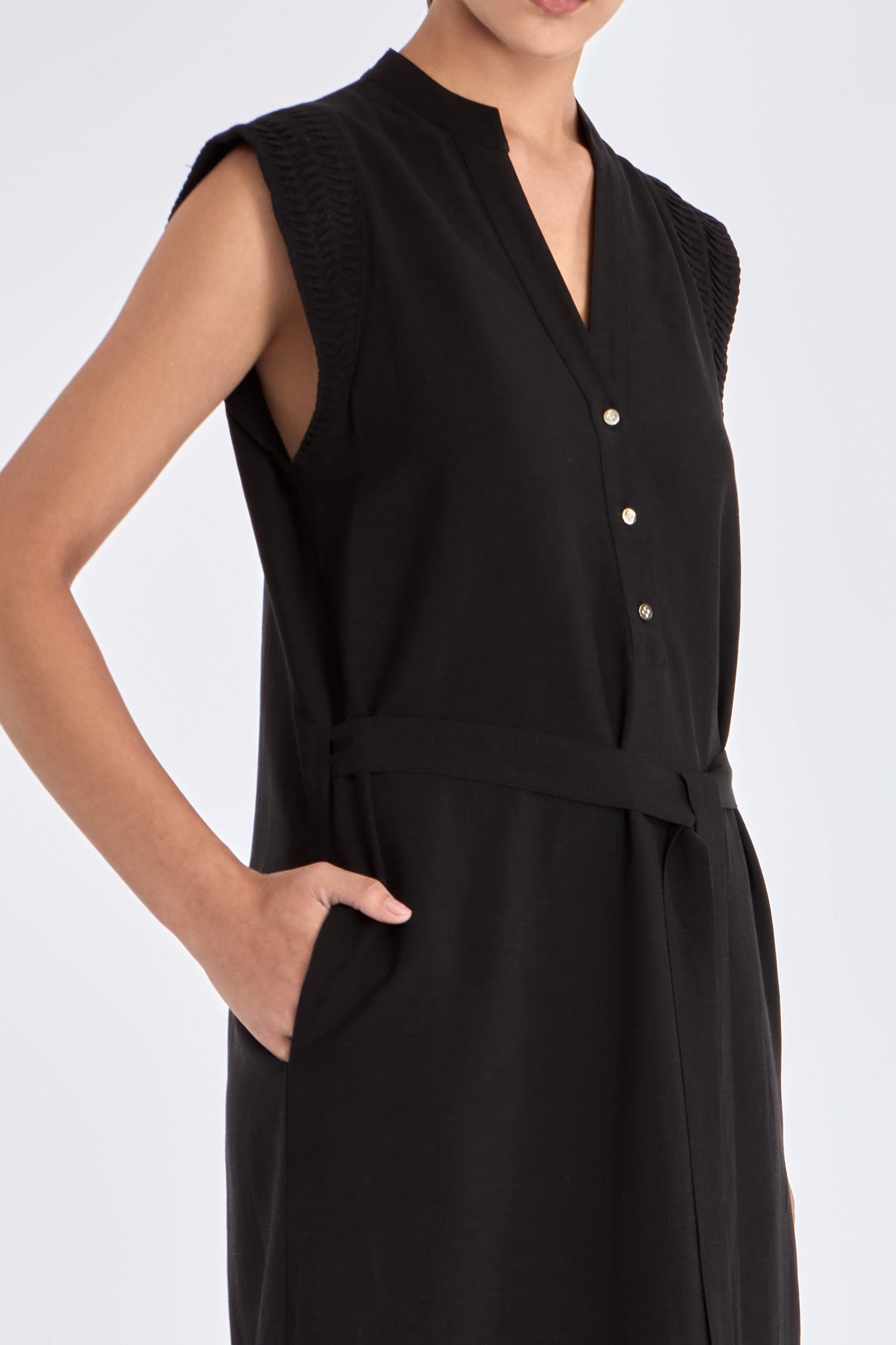 Front view of the Denver Dress in black, showcasing its Nehru collar and artisan-embroidered hem.
