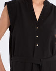 Front view of the Denver Dress in black, showcasing its Nehru collar and artisan-embroidered hem.