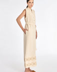 Denver Dress in Ecru – Sleeveless linen midi dress with embroidered hem by AMEDBAM, metal buttons, and fabric belt.