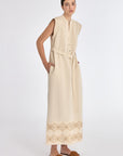 Denver Dress in Ecru – Sleeveless linen midi dress with embroidered hem by AMEDBAM, metal buttons, and fabric belt.