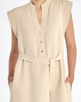 Denver Dress in Ecru – Sleeveless linen midi dress with embroidered hem by AMEDBAM, metal buttons, and fabric belt.