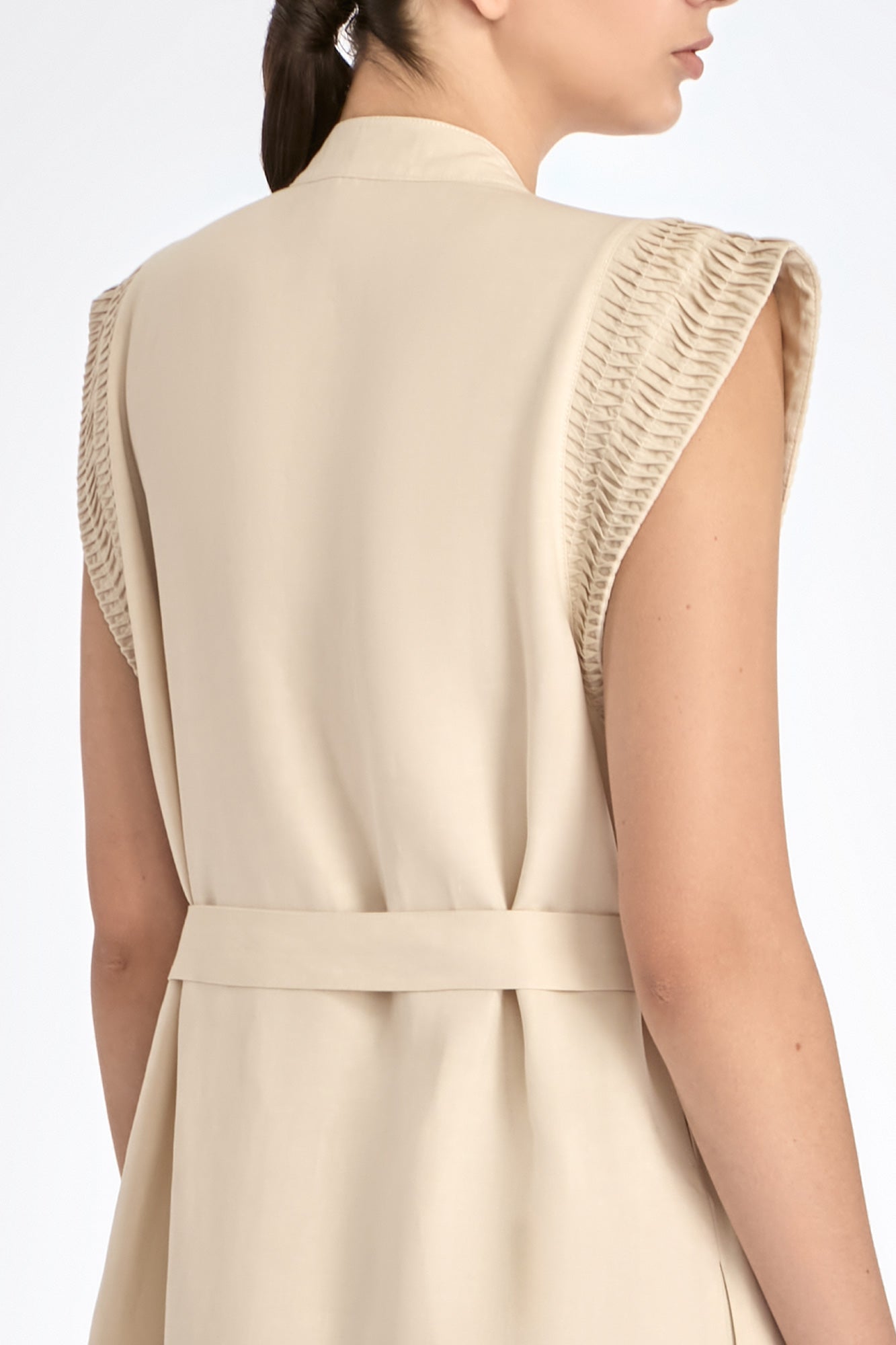 Denver Dress in Ecru – Sleeveless linen midi dress with embroidered hem by AMEDBAM, metal buttons, and fabric belt.