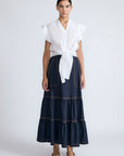 Eden Skirt in Navy – Cotton midi skirt with ruffled hem, front patch pockets, and elasticized back waistband.