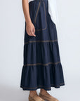 Eden Skirt in Navy – Cotton midi skirt with ruffled hem, front patch pockets, and elasticized back waistband.