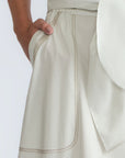 Eden Skirt in Silver – Cotton midi skirt with ruffled hem, patch pockets, and elasticized waistband at the back.