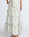 Eden Skirt in Silver – Cotton midi skirt with ruffled hem, patch pockets, and elasticized waistband at the back.