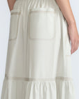Eden Skirt in Silver – Cotton midi skirt with ruffled hem, patch pockets, and elasticized waistband at the back.