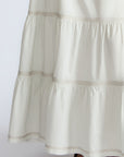 Eden Skirt in Silver – Cotton midi skirt with ruffled hem, patch pockets, and elasticized waistband at the back.