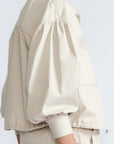 Gwen Jacket in Prestine – Elegant cropped cotton jacket with patch pockets and front pleats for added structure.
