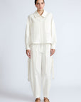 Gwen Jacket in Off White – Cropped cotton jacket with front pleats, shirt collar, and patch pockets.