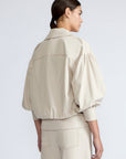 Gwen Jacket in Prestine – Elegant cropped cotton jacket with patch pockets and front pleats for added structure.