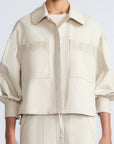 Gwen Jacket in Prestine – Elegant cropped cotton jacket with patch pockets and front pleats for added structure.