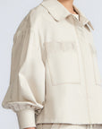 Gwen Jacket in Prestine – Elegant cropped cotton jacket with patch pockets and front pleats for added structure.