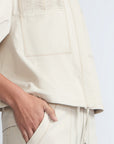 Gwen Jacket in Prestine – Elegant cropped cotton jacket with patch pockets and front pleats for added structure.