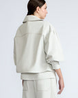 Gwen Jacket in Silver – Cropped cotton jacket with structured pleats, patch pockets, and a modern cut.