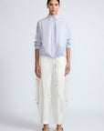 Hebe Blouse in Light Blue Stripes – Relaxed blouse with lapel collar, hidden buttons, asymmetrical hem, and elasticized long sleeves.