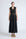 Isidora Dress in Black – Sleeveless midi cotton dress with shirt collar V-neckline, tiered silhouette, and hidden side pockets.