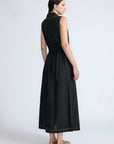 Isidora Dress in Black – Sleeveless midi cotton dress with shirt collar V-neckline, tiered silhouette, and hidden side pockets.