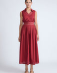 Isidora Dress in Wine – Sleeveless cotton maxi dress with shirt collar, V-neckline, hidden pockets, and tiered silhouette.