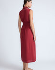 Isidora Dress in Wine – Sleeveless cotton maxi dress with shirt collar, V-neckline, hidden pockets, and tiered silhouette.