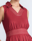 Isidora Dress in Wine – Sleeveless cotton maxi dress with shirt collar, V-neckline, hidden pockets, and tiered silhouette.
