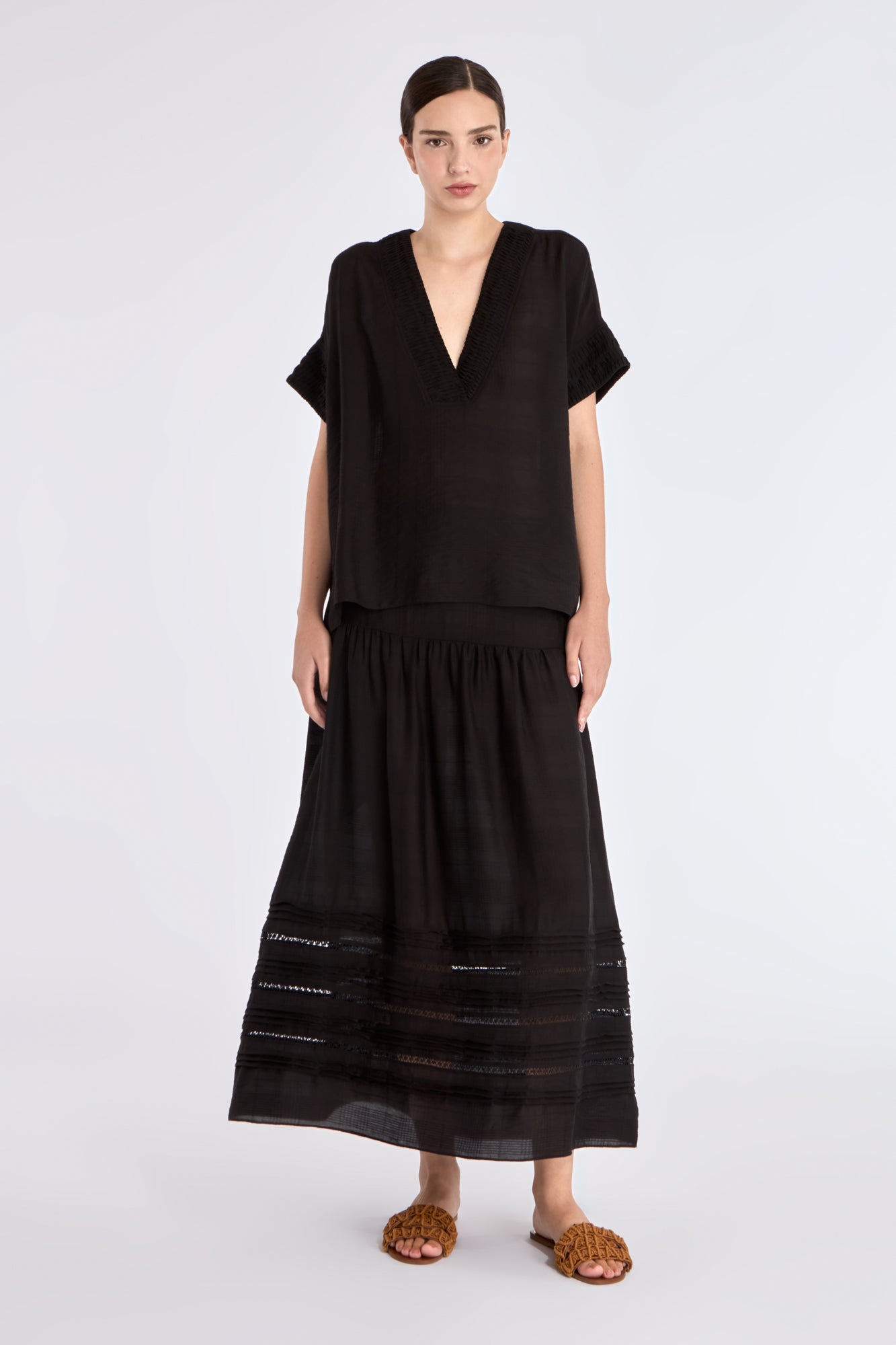 Front view of the Ivy Blouse in black, showcasing its classic V-neckline and relaxed silhouette.