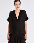 Front view of the Ivy Blouse in black, showcasing its classic V-neckline and relaxed silhouette.