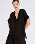 Front view of the Ivy Blouse in black, showcasing its classic V-neckline and relaxed silhouette.