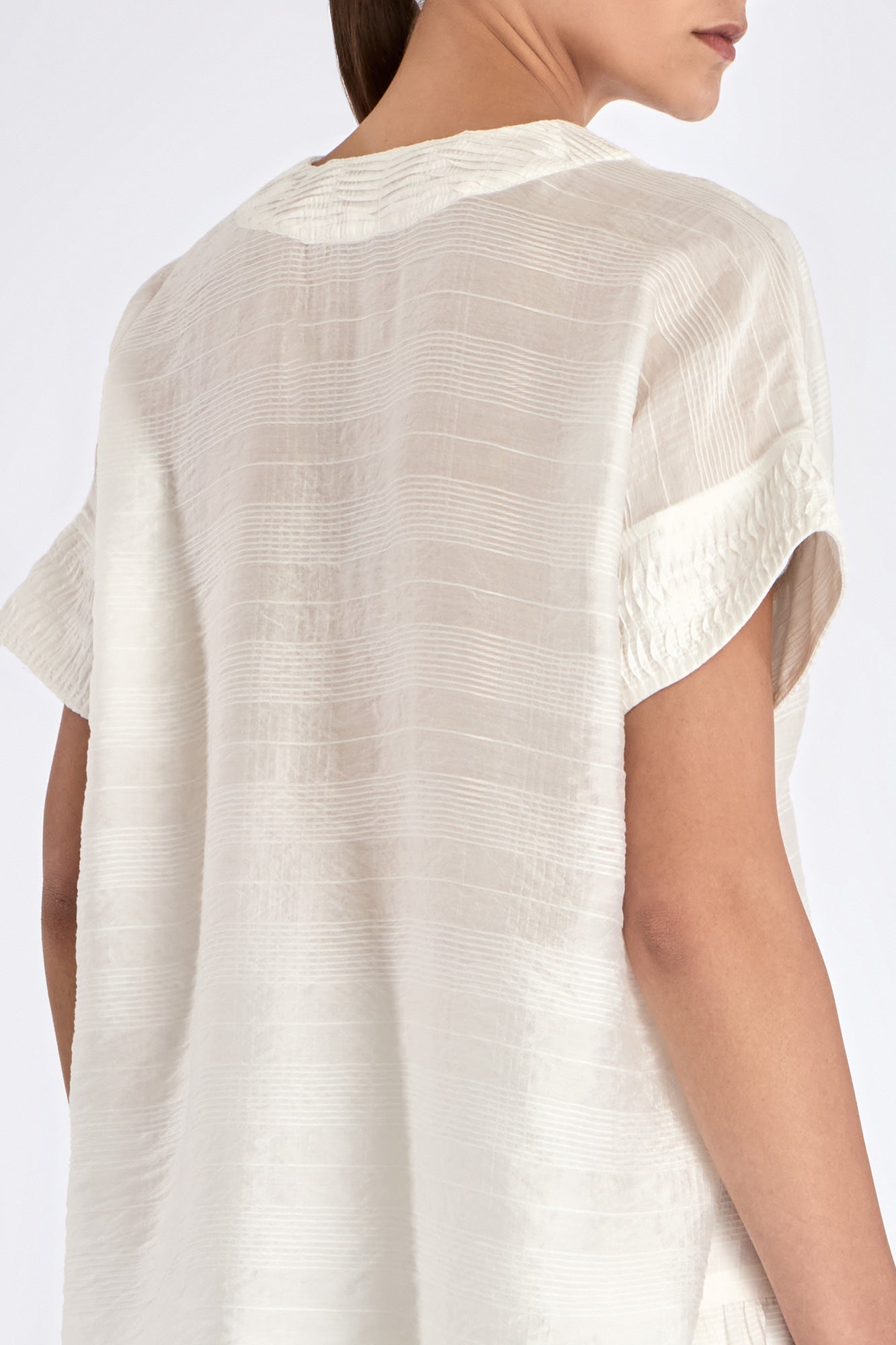 Elegant back view of the Ivy Blouse in Off White.