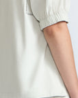Jamie Top in Silver – 100% cotton blouse with mixed textures, round neckline, and ¾ sleeves with elasticated cuffs.