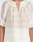Detail shot of the V-slit neckline with its metal-tipped drawstrings on the Off White Lauren Blouse.